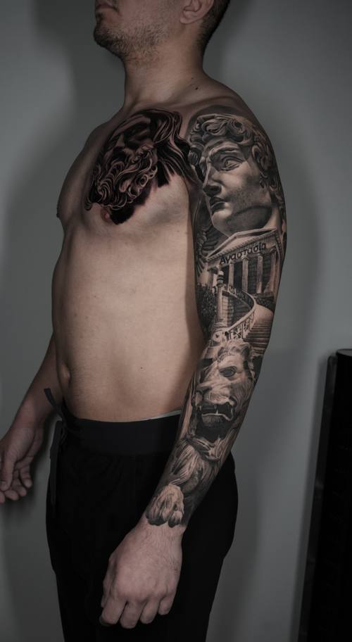 Classical statues and a lion, black and grey sleeve and chest tattoo