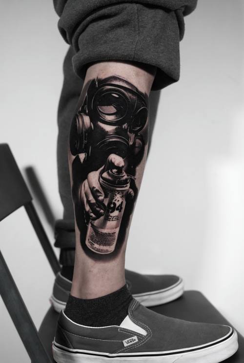 Gas mask and spray can, black and grey realism calf tattoo