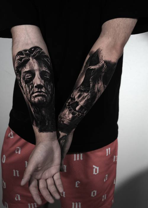 Weeping marble statue faces, matching black and grey forearm tattoos