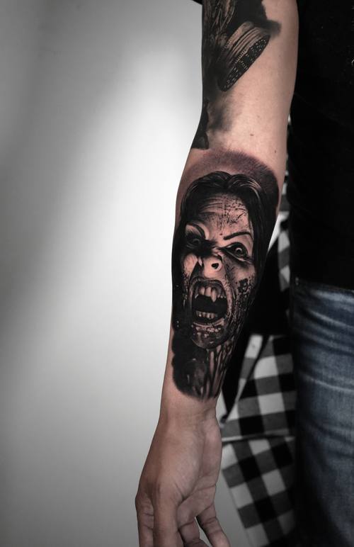 Screaming horror woman portrait, black and grey realism forearm tattoo