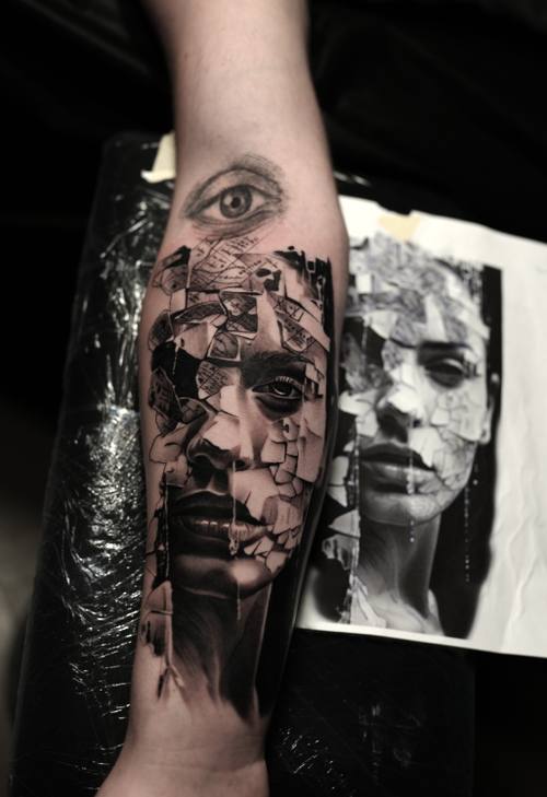 Shattered woman portrait with an eye, black and grey realism forearm tattoo