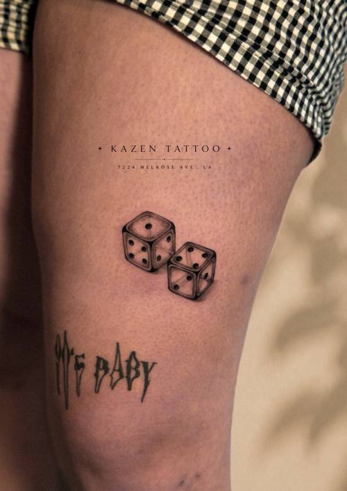 Pair of dice with lettering, thigh tattoo by Amina at KAZENTATTOO, Los Angeles
