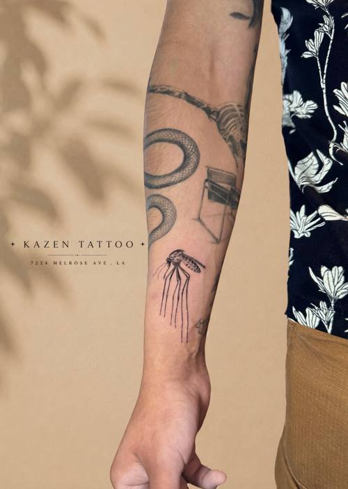 Colour flowers on the forearm by Amina at KAZENTATTOO, Los Angeles