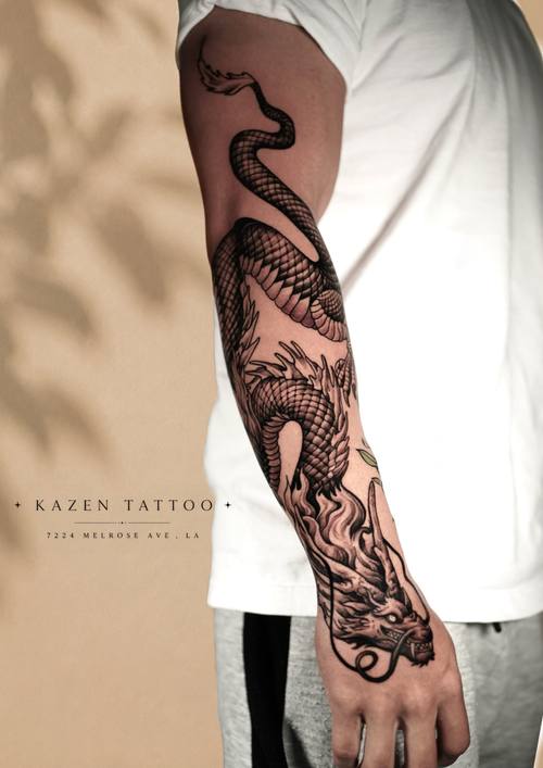 Snake with botanical work, fine line arm sleeve by Amina at KAZENTATTOO, Los Angeles