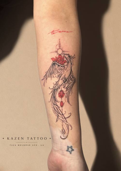 Red and black botanical composition on the forearm by Amina at KAZENTATTOO, Los Angeles