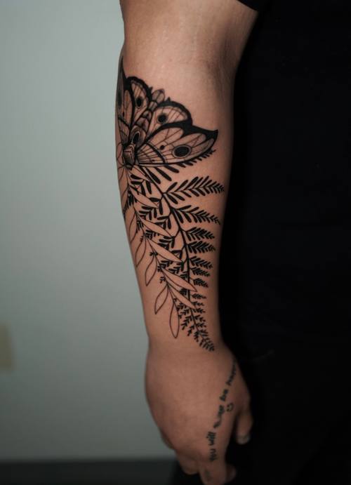 Fern and leaves along the forearm, fine line tattoo by Amina at KAZENTATTOO, Los Angeles