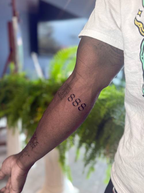 Small script on the forearm, fine line tattoo by Amina at KAZENTATTOO, Los Angeles