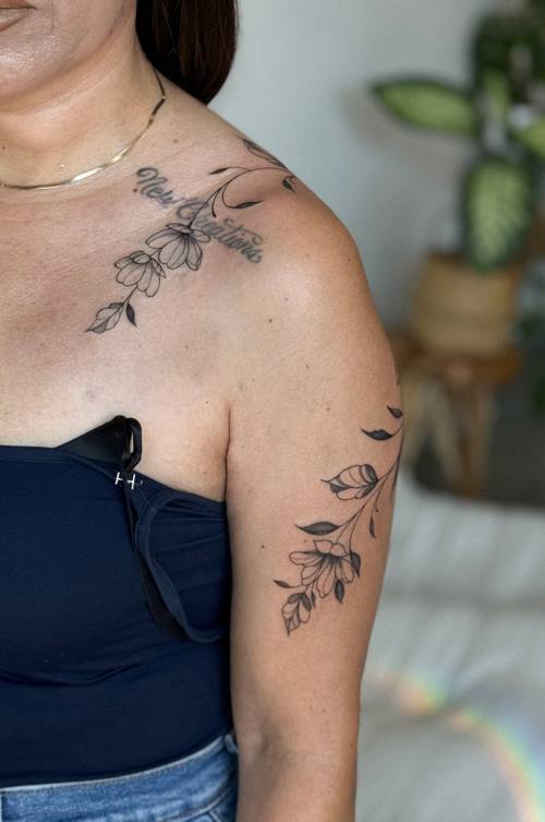 Botanical branch running from the shoulder across the collarbone, fine line tattoo by Amina at KAZENTATTOO, Los Angeles