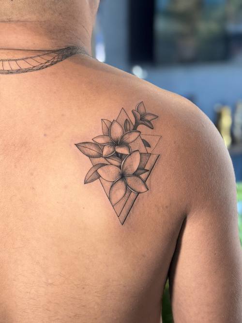 Magnolia on the shoulder blade, fine line tattoo by Amina at KAZENTATTOO, Los Angeles