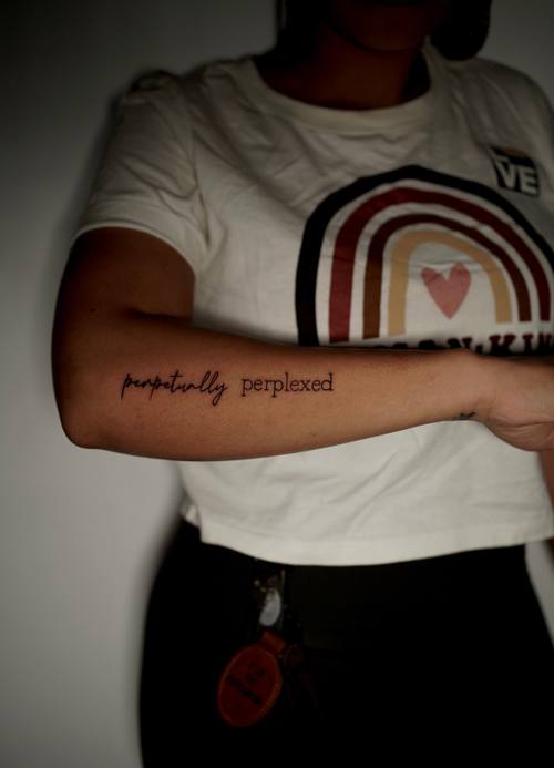 Tiny script on the forearm, fine line tattoo by Amina at KAZENTATTOO, Los Angeles