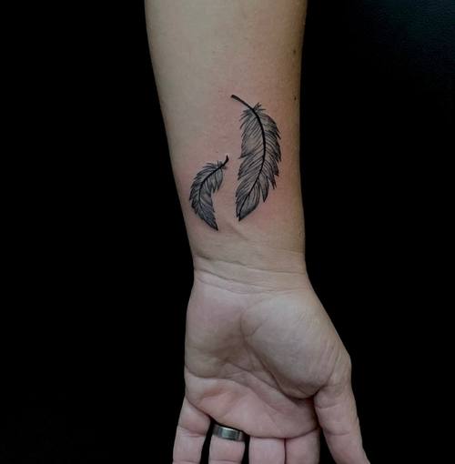 Feather on the forearm, fine line tattoo by Amina at KAZENTATTOO, Los Angeles