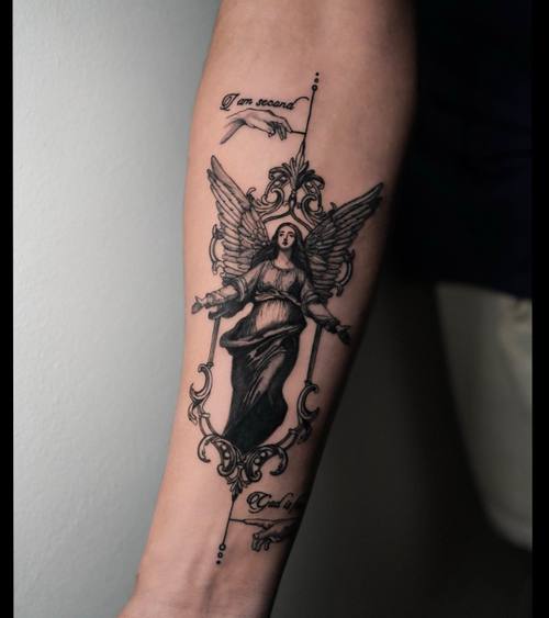 Winged figure with a banner on the forearm by Amina at KAZENTATTOO, Los Angeles, second view