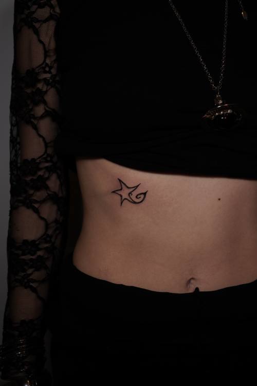 Small symbol on the stomach, fine line tattoo by Amina at KAZENTATTOO, Los Angeles