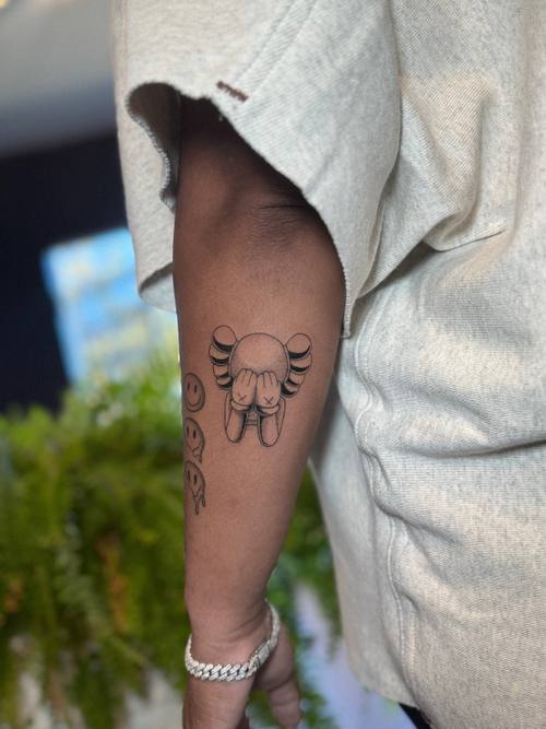 Small cat face outline on the forearm by Amina at KAZENTATTOO, Los Angeles, second view