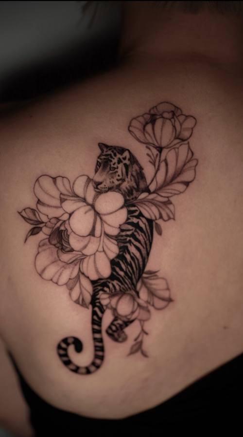 Seahorse with flowers on the back, fine line tattoo by Amina at KAZENTATTOO, Los Angeles