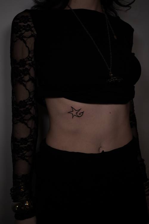Small symbol on the stomach by Amina at KAZENTATTOO, Los Angeles, second view