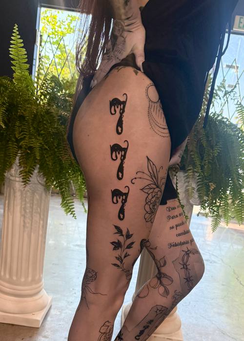 Repeating numerals down the leg by Amina at KAZENTATTOO, Los Angeles, second view