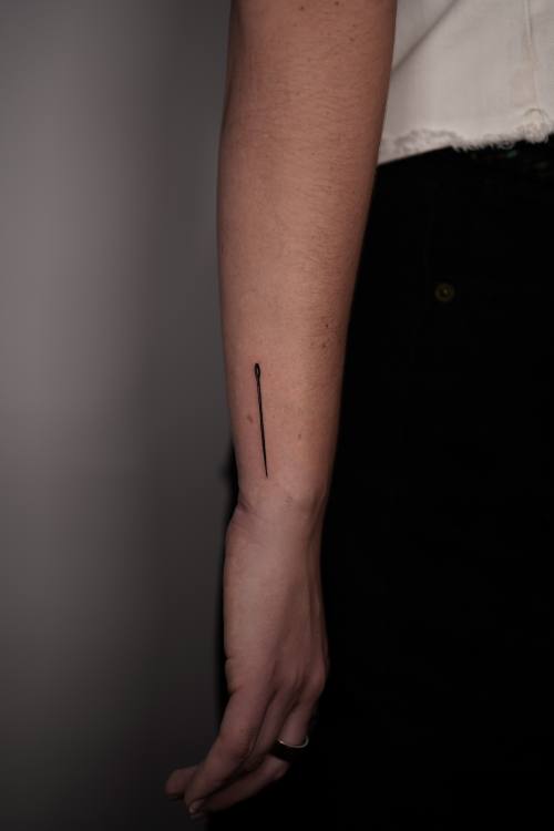 Thin line along the inner forearm, fine line tattoo by Amina at KAZENTATTOO, Los Angeles