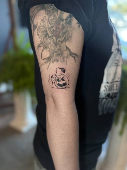 Potted plant with a pumpkin on the thigh, fine line tattoo by Amina at KAZENTATTOO, Los Angeles