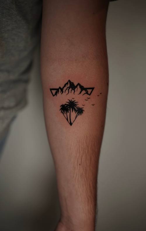 Mountain range with a tree on the shin by Amina at KAZENTATTOO, Los Angeles, second view