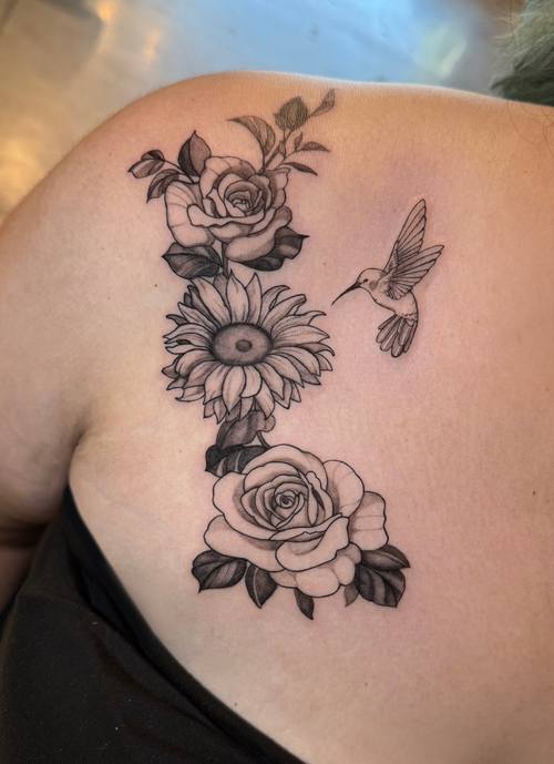 Roses with a hummingbird on the shoulder blade, fine line tattoo by Amina at KAZENTATTOO, Los Angeles