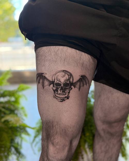 Winged skull on the thigh by Amina at KAZENTATTOO, Los Angeles, third view