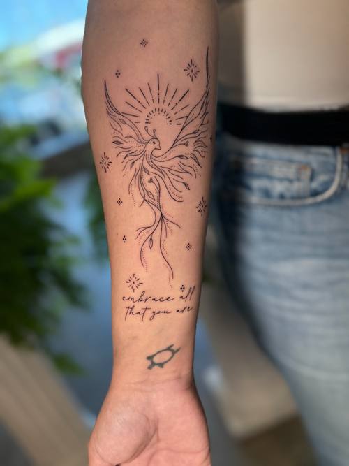 Sun motif with script on the forearm, fine line tattoo by Amina at KAZENTATTOO, Los Angeles