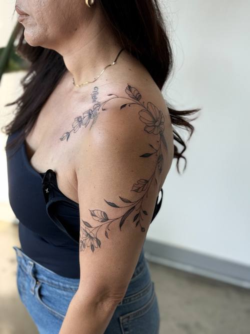 Botanical branch from the shoulder across the collarbone by Amina at KAZENTATTOO, Los Angeles, second view