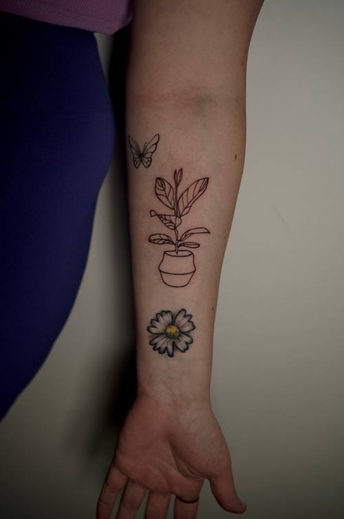 Potted plant with a clover on the forearm, fine line tattoo by Amina at KAZENTATTOO, Los Angeles