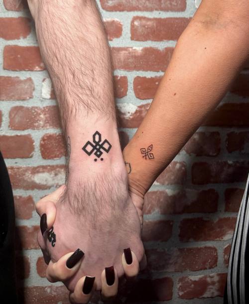 Matching symbols on two hands, fine line tattoos by Amina at KAZENTATTOO, Los Angeles