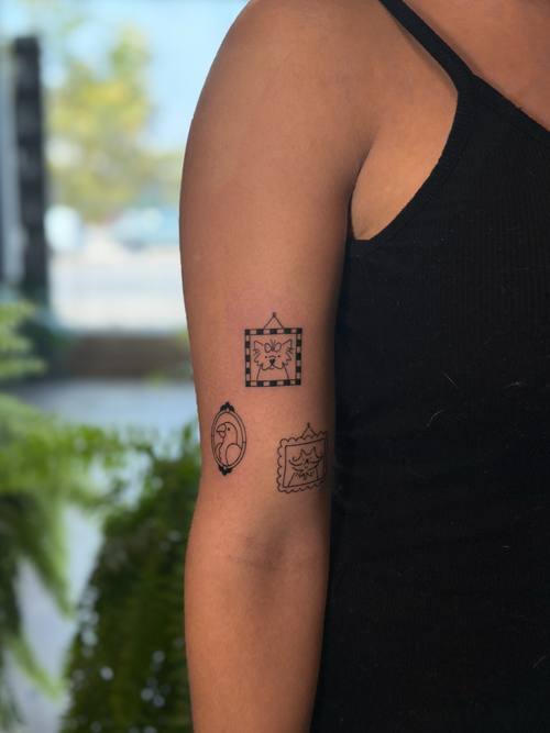 Small square symbols on the upper arm, fine line tattoo by Amina at KAZENTATTOO, Los Angeles