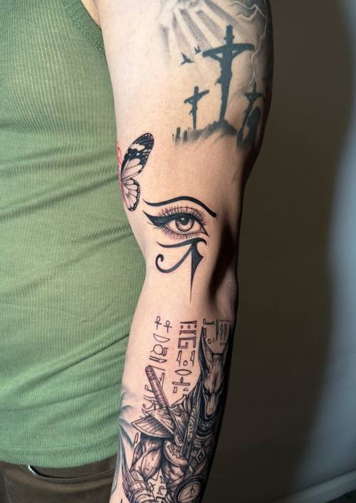 Eye of Horus with ornament on the arm, fine line tattoo by Amina at KAZENTATTOO, Los Angeles