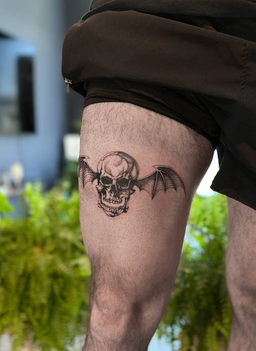 Winged skull on the thigh by Amina at KAZENTATTOO, Los Angeles, second view