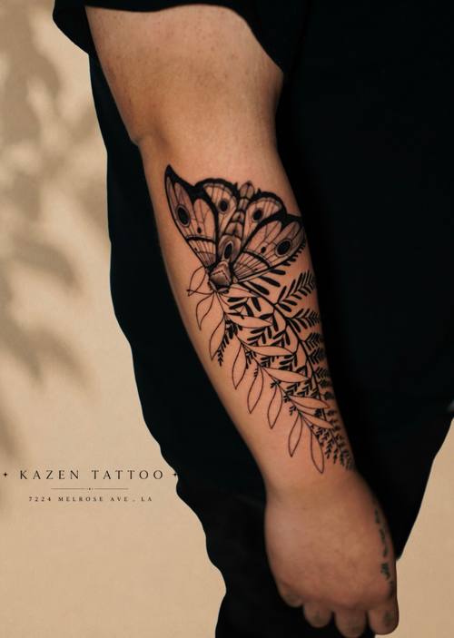 Floral composition across the shoulder and upper arm, black and grey tattoo by Amina at KAZENTATTOO, Los Angeles