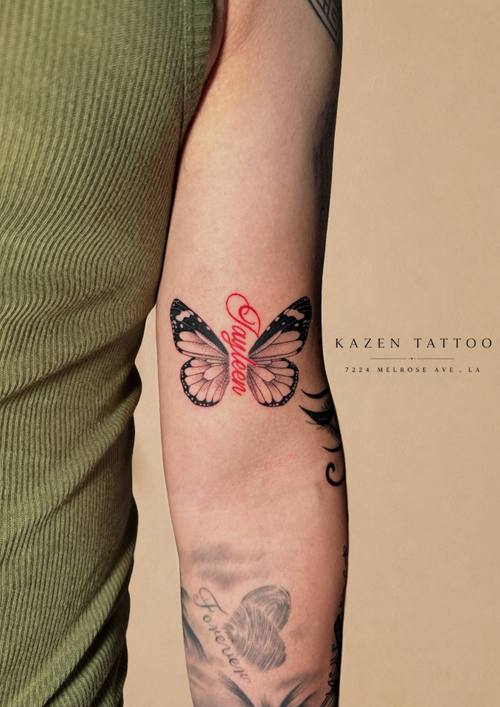 Colour butterfly with script, forearm tattoo by Amina at KAZENTATTOO, Los Angeles