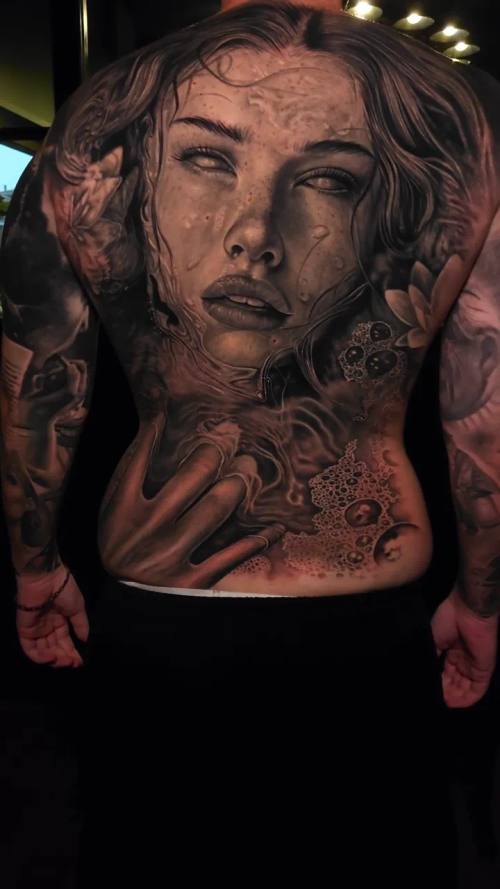 Woman's portrait with roses, black and grey chest and neck tattoo by Livio at KAZENTATTOO, Los Angeles