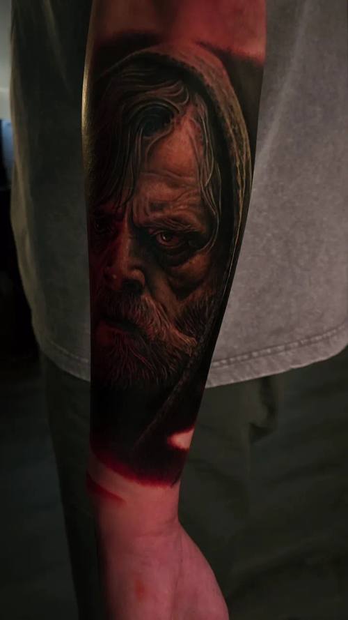 Pale horror face, colour realism calf tattoo by Livio at KAZENTATTOO, Los Angeles