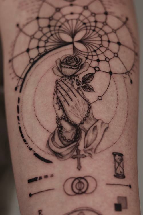Praying hands with a rose inside a geometric mandala, fine line forearm tattoo by Marrie at KAZENTATTOO, Los Angeles