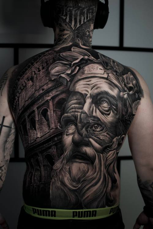 Elderly man's portrait framed by architecture, black and grey full back tattoo by Marko at KAZENTATTOO, Los Angeles