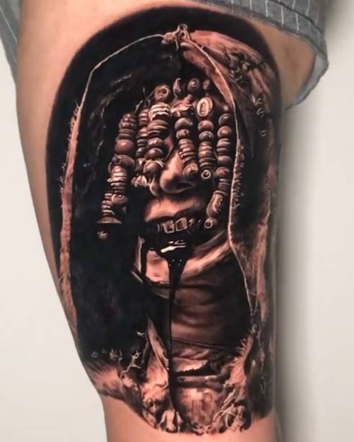 Cracked skin revealing a monstrous head, black and grey realism thigh tattoo by Nihat at KAZENTATTOO, Los Angeles