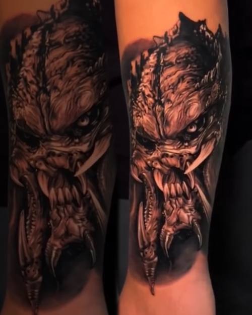 Horned gargoyle with bared teeth, black and grey realism arm tattoo by Nihat at KAZENTATTOO, Los Angeles