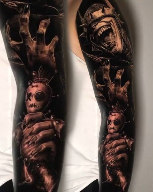 Reaching hands, a screaming demon and a doll figure, black and grey horror sleeve by Nihat at KAZENTATTOO, Los Angeles