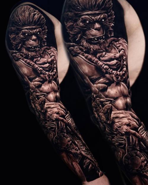 Muscular demon with sculptural armour, black and grey full sleeve by Nihat at KAZENTATTOO, Los Angeles
