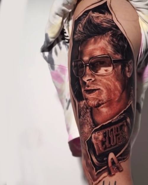 Portrait of a man in sunglasses with lettering, black and grey realism arm tattoo by Nihat at KAZENTATTOO, Los Angeles