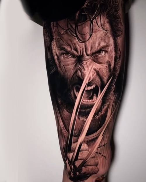 Fierce man with metal claws, black and grey realism calf tattoo by Nihat at KAZENTATTOO, Los Angeles