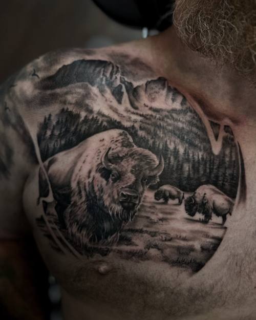 Mountain landscape with bears and a river, black and grey chest tattoo by Sam at KAZENTATTOO, Los Angeles