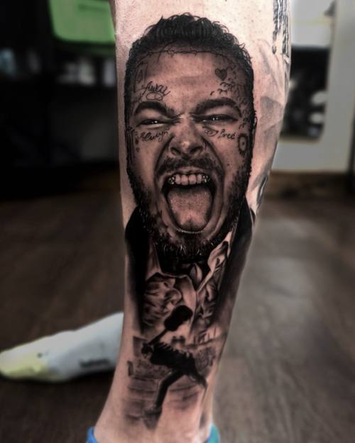 Screaming man's portrait with splashes of ink, black and grey forearm tattoo by Sam at KAZENTATTOO, Los Angeles