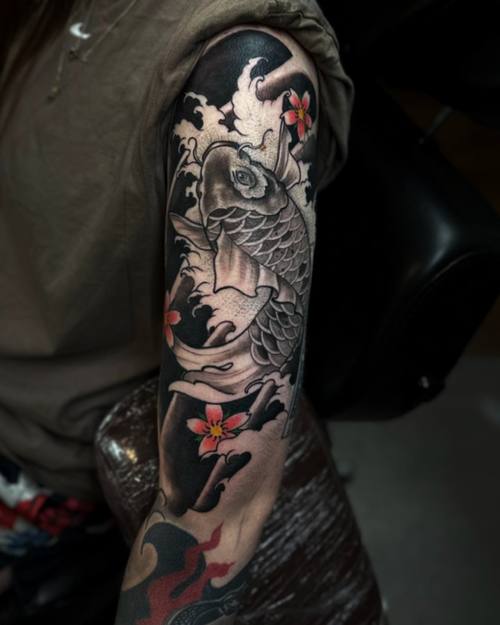 Koi and cherry blossom, colour Japanese sleeve by Sam at KAZENTATTOO, Los Angeles