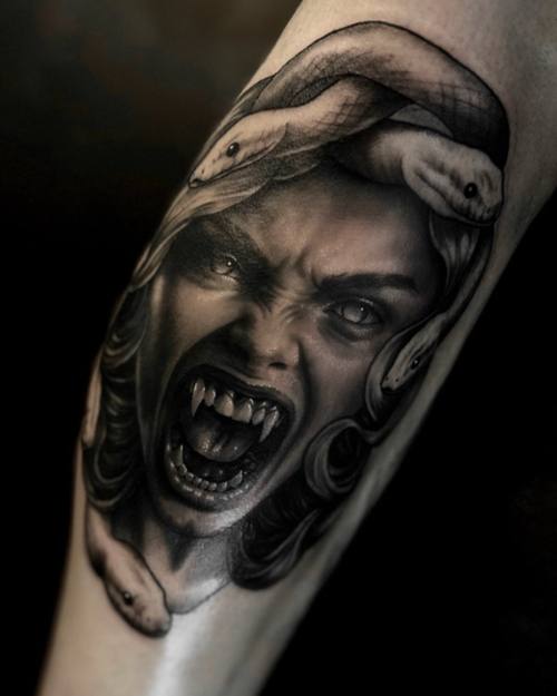 Screaming vampire woman with a snake, black and grey realism forearm tattoo by Sam at KAZENTATTOO, Los Angeles