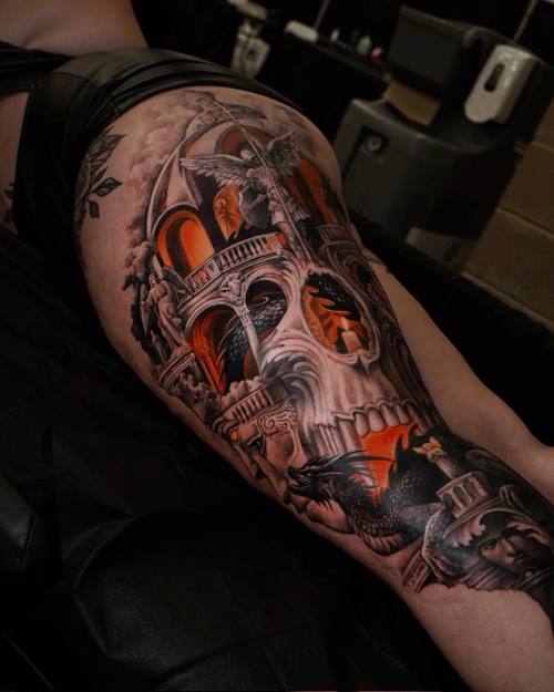 Skull with cathedral arches, dragon and archangel, thigh tattoo by Vladimir Kozachenko